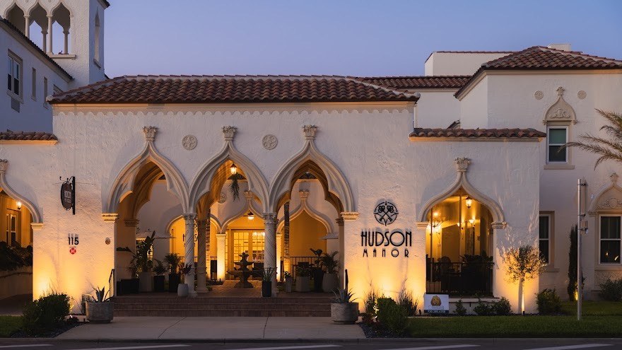 Senior living community exterior at dusk